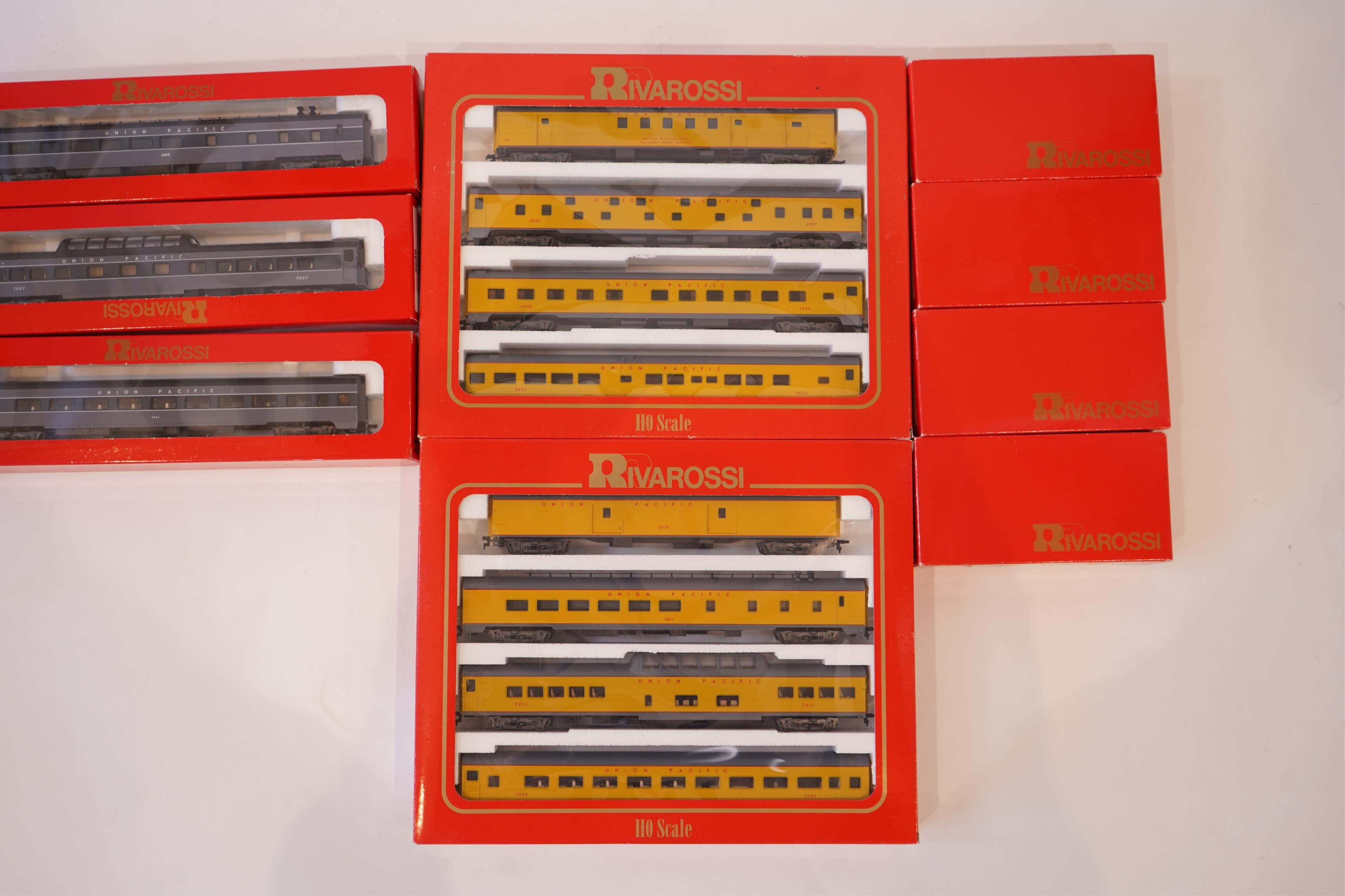 Two boxed Rivarossi 1930s Union Pacific coach packs; A Set (6964) and B Set (6965), both containing four coaches, together with three individually boxed coaches (2654, 2689 and 2814), plus four bogie freight wagons (2255